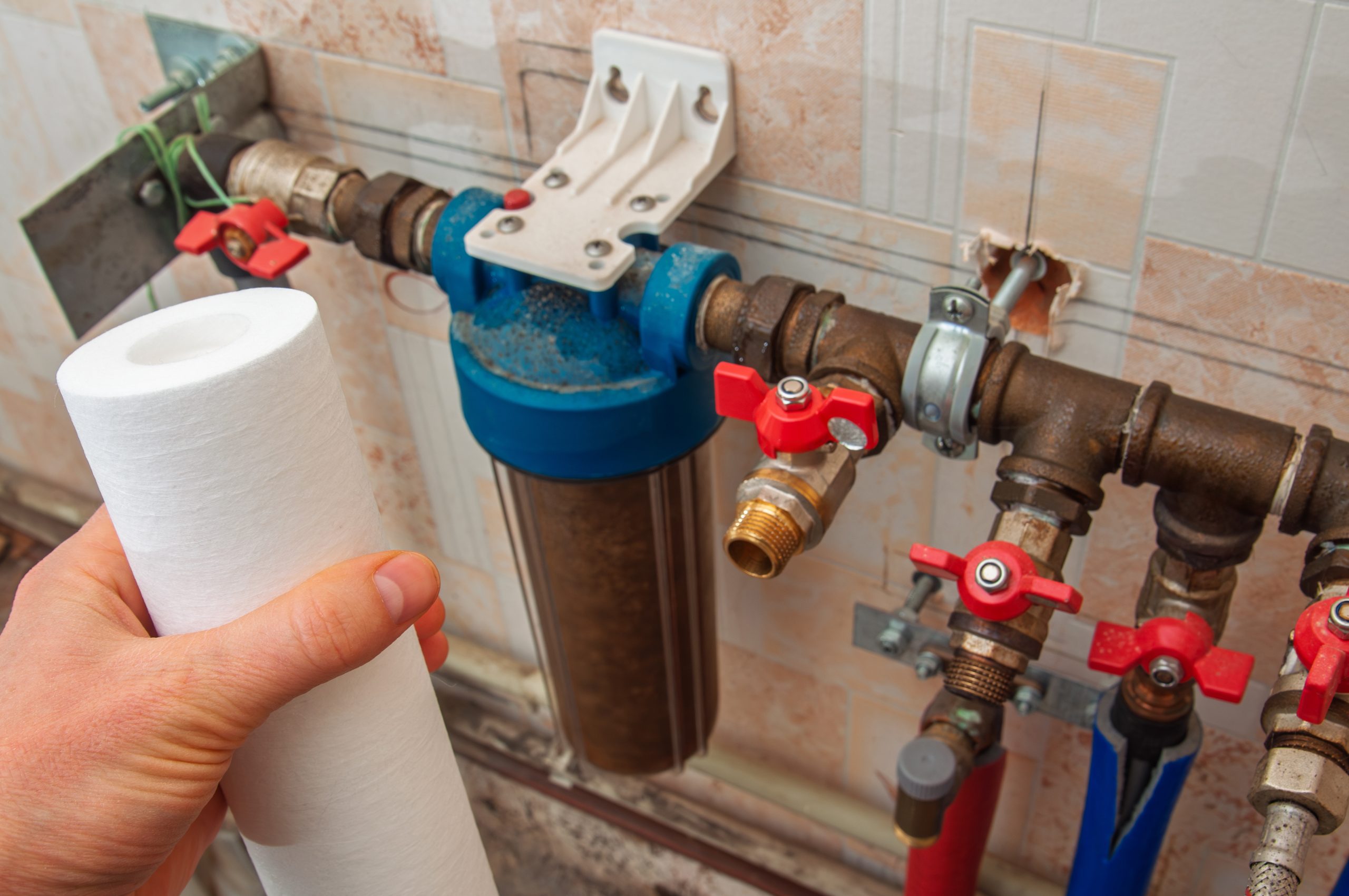 Replacing a dirty water filter cartridge in a household filtration system